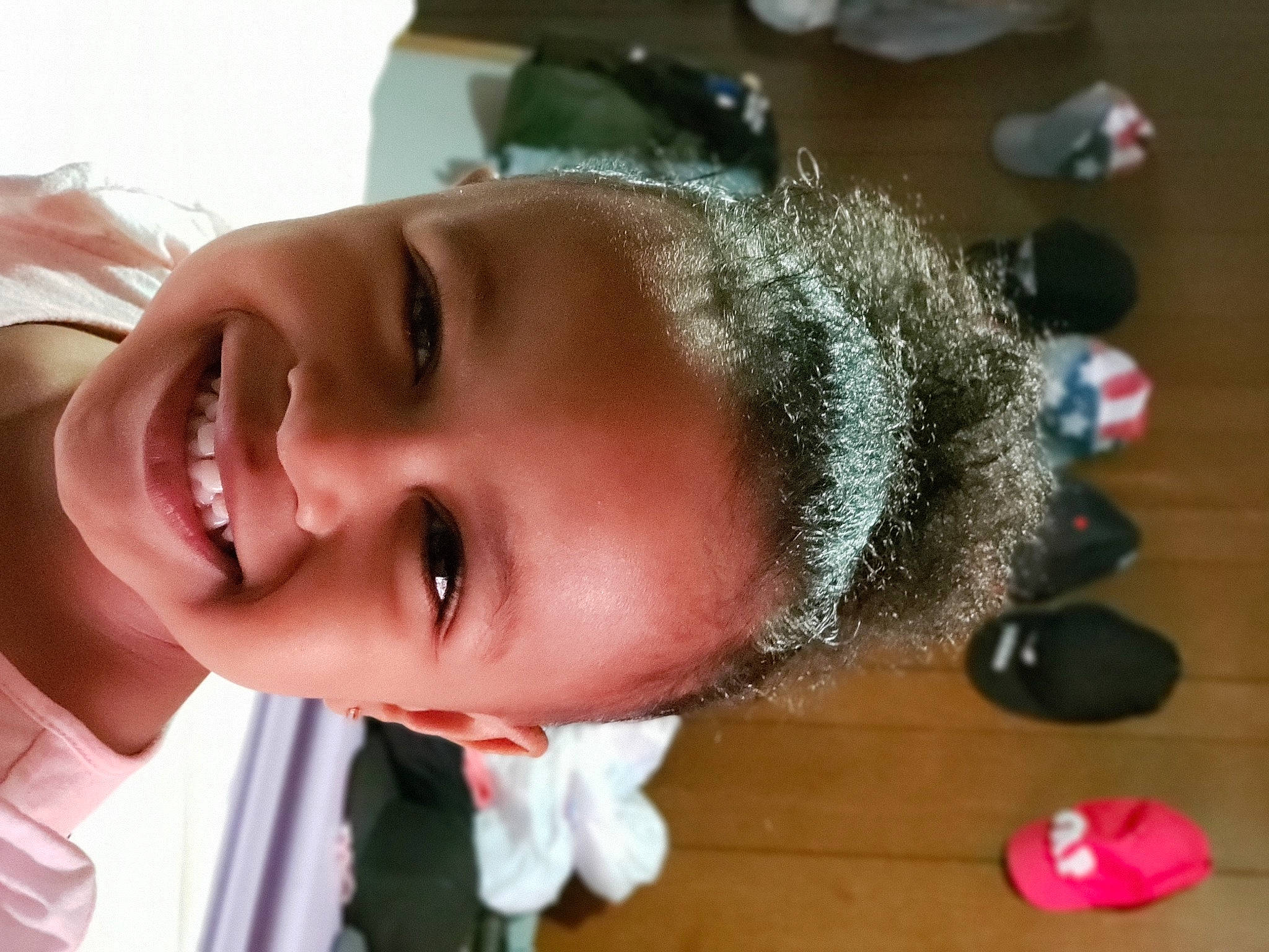 Arienna is registered to the contest to win money with this photo: baby, black_hair, cheek, chin, dress, ear, eyebrow, eyelash, finger, happy, hat, iris, joy, lip, mouth, neck, nose, person, plant, smile