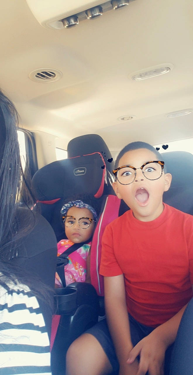 Nai'Lani is registered to the contest to win money with this photo: black_hair, child, eyewear, family_car, fun, glasses, happy, head, leisure, mouth, person, photography, selfie, skin, smile, toddler, vacation, vehicle, vision_care