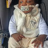 baby, infant, pacifier, car_seat, white_clothing, vest, socks, warning_label, child, cute, indoor, seatbelt, soft_toys, blanket, portrait, young_child, curly_hair, casual_wear, clothing, comfort