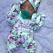 Jazariah joined the competition — help win amazing prizes! baby, blanket, bow, butterfly, child, clothing, cozy, cute, floral, headband, infant, lavender, newborn, pacifier, person, portrait, purple, sleeping, soft, toddler