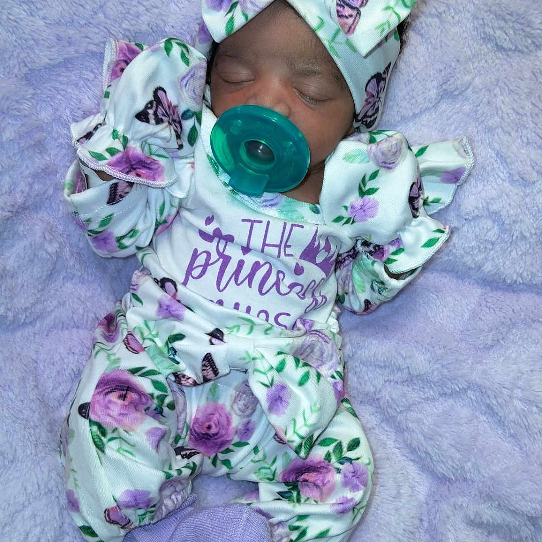 Jazariah joined the competition — help win amazing prizes! baby, blanket, bow, butterfly, child, clothing, cozy, cute, floral, headband, infant, lavender, newborn, pacifier, person, portrait, purple, sleeping, soft, toddler