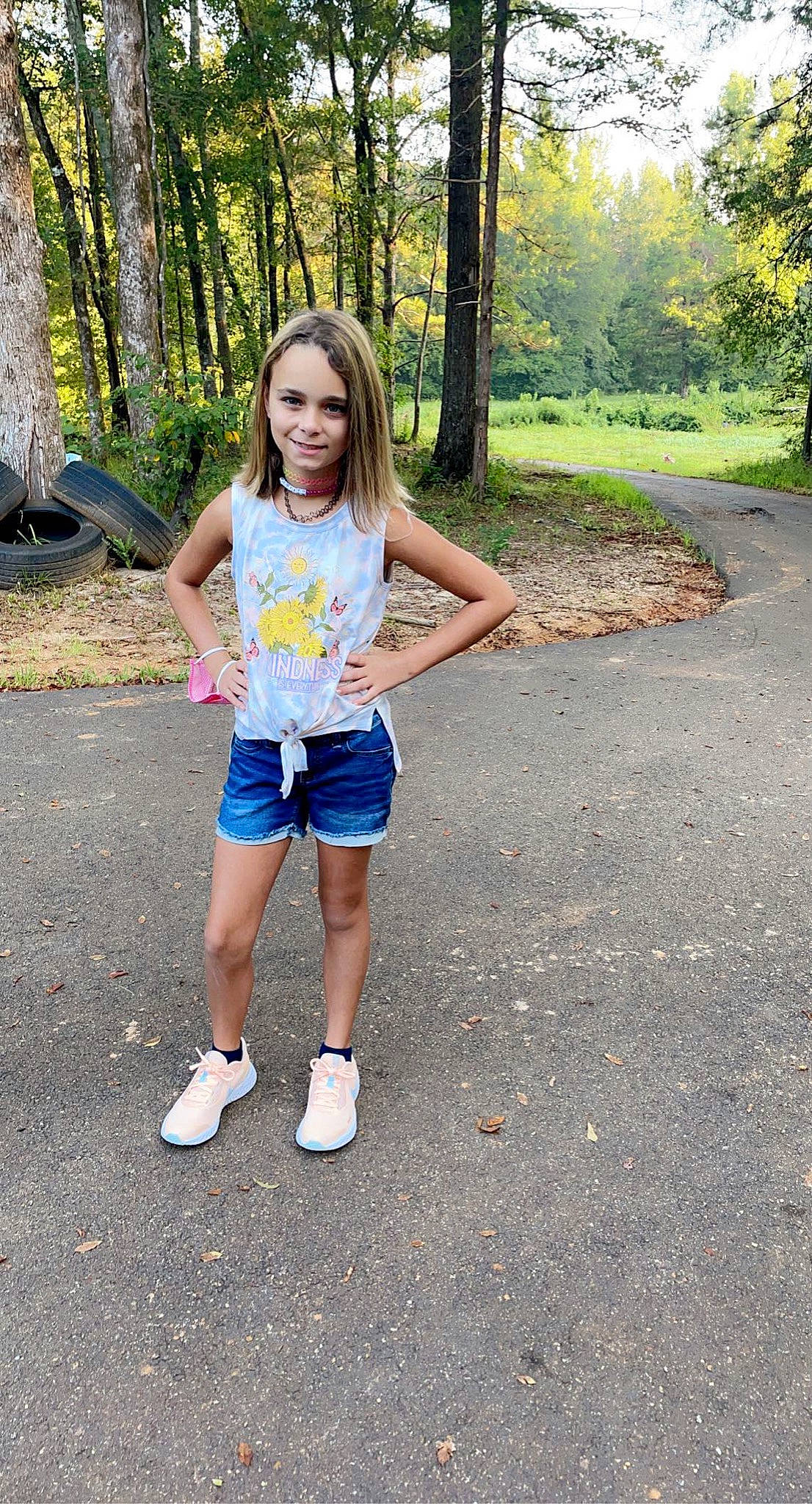 Braylee joined the competition — help win amazing prizes! asphalt, denim, electric_blue, forest, fun, grass, happy, human_leg, joy, knee, leaf, leisure, long_hair, people_in_nature, person, plant, recreation, road, shorts, t_shirt