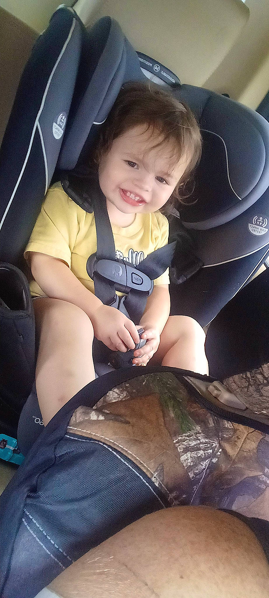 Payton Rose is registered to the contest to win money with this photo: arm, automotive_design, automotive_tire, car_seat, comfort, cool, flash_photography, gesture, happy, head, human_body, joy, knee, motor_vehicle, person, smile, steering_wheel, thigh, tints_and_shades, toddler