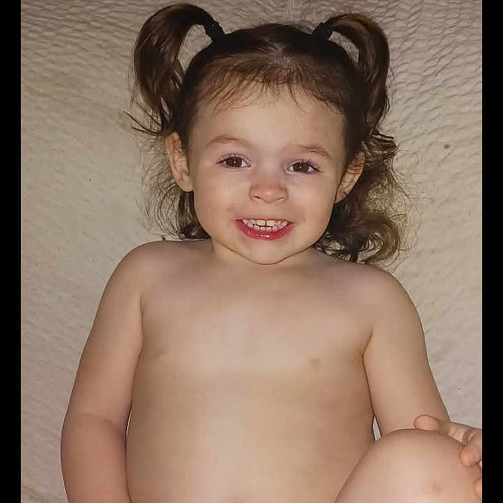 Payton Rose joined the competition — help win amazing prizes! baby, blanket, child, comfortable, cute, diaper, face, fun, hair, happy, indoor, light, pigtails, playful, portrait, sitting, skin, smiling, toddler, young_child