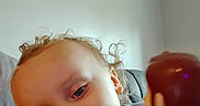 Bellamy joined the competition — help win amazing prizes! toddler, child, curly_hair, smiling, toy, woody_doll, indoor, couch, portrait, person, face, blue_eyes, casual_clothing, playtime, young_child, happy, closeup, hair, skin, home