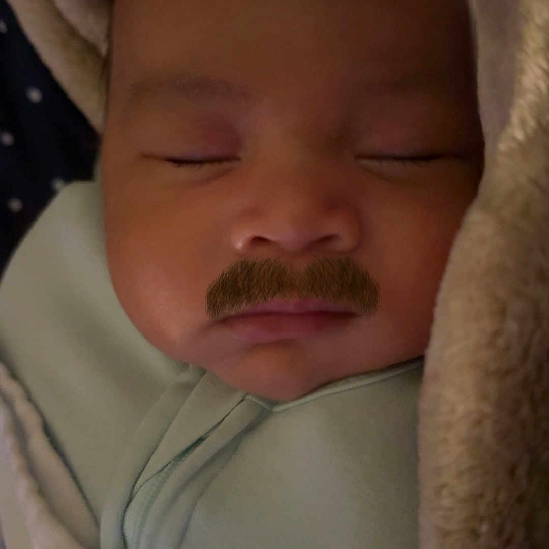 Axcel is registered to the contest to win money with this photo: baby, bed, blanket, bodypart, bonnet, clothing, cushion, face, finger, hand, hat, head, homedecor, hood, newborn, person, photography, portrait, sleeping, towel