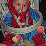 baby, pacifier, spiderman_onesie, baby_rocker, indoor, child, infant, clothing, footwear, toy, patterned_fabric, seat, comfort, cute, expression, head, face, hand, foot, carpet