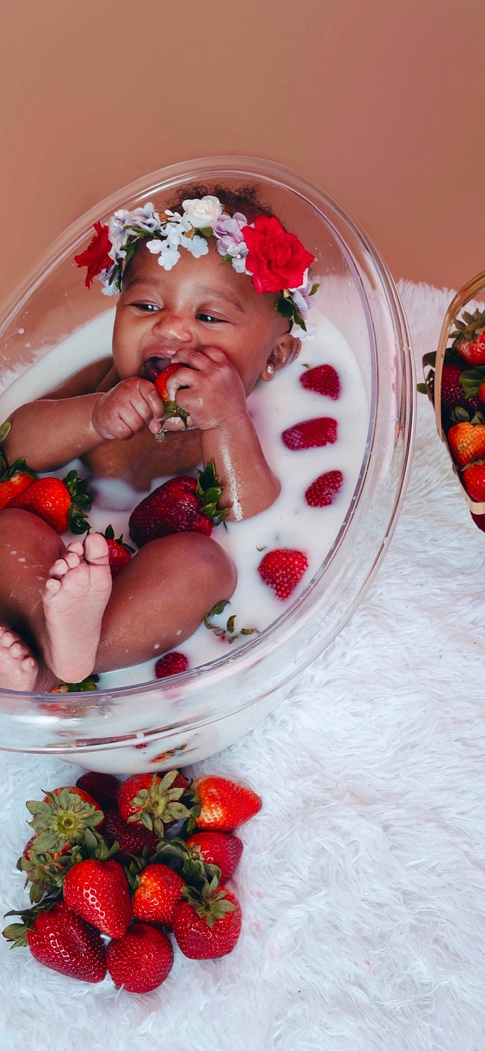 Avah is registered to the contest to win money with this photo: baby, child, event, face, fashion_accessory, flower, food, fruit, happy, headwear, jewellery, lei, natural_foods, person, plate, red, serveware, smile, strawberry, sweetness