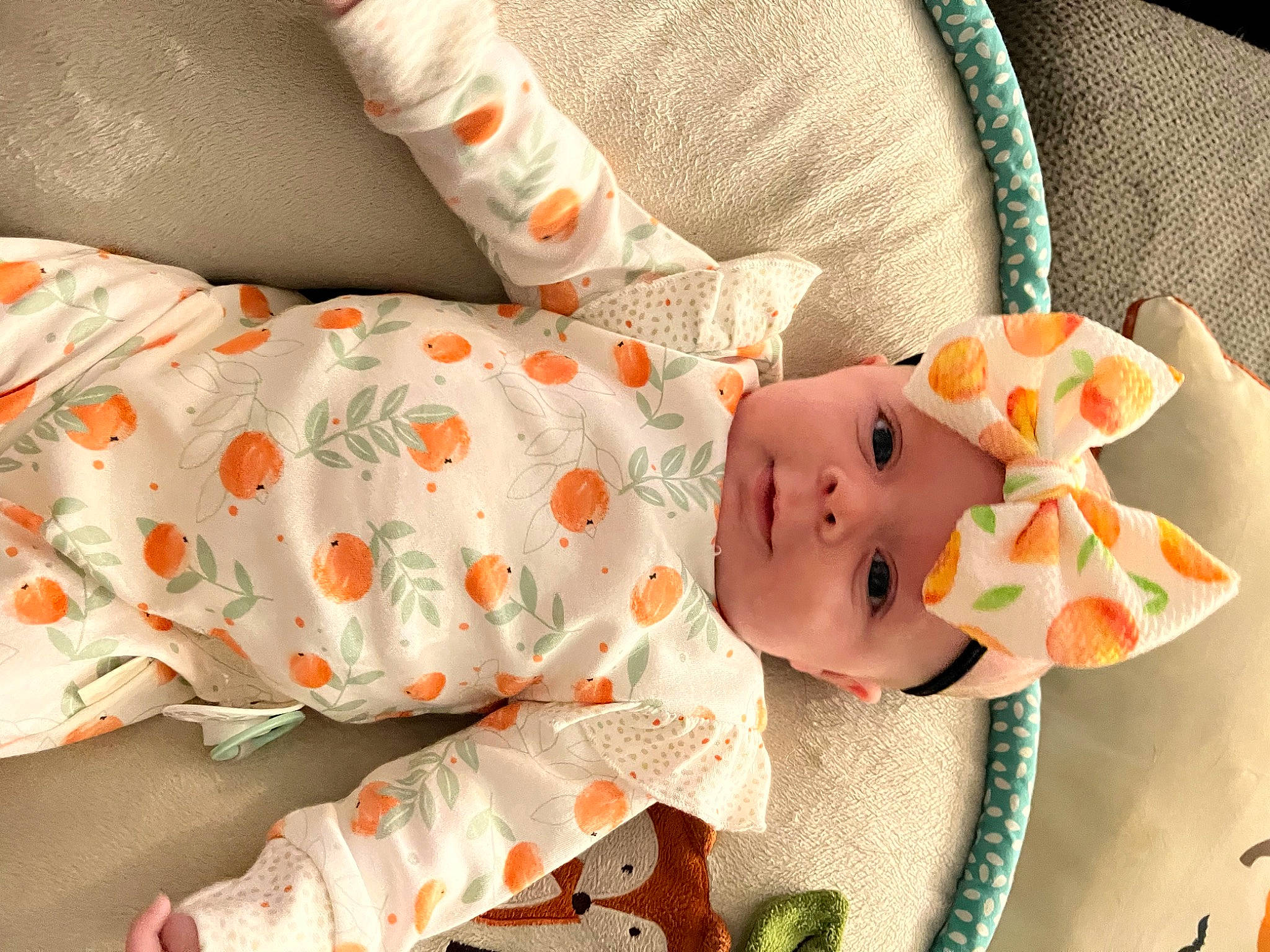 Caroline joined the competition — help win amazing prizes! baby, baby_products, baby_sleeping, baby_toddler_clothing, child, comfort, hand, headwear, infant_bodysuit, linens, nail, orange, pattern, peach, person, petal, product, room, skin, sleeve