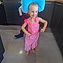 Hélya a rejoint le concours — aidez-le/la à gagner de superbes lots ! child, girl, pink_clothing, blue_pillow, kitchen, barefoot, smile, happy, playful, floor, cabinet, countertop, person, indoor, headwear, casual, young_child, funny_pose, curly_hair, domestic
