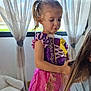 child, girl, princess_dress, hair_brushing, woman, indoor, curtains, window, stuffed_unicorn, toy, playful, blonde_hair, purple, pink, yellow, fabric, person, home, interaction, casual