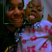 Harmoni is registered to the contest to win money with this photo: child, woman, smile, tongue_out, face, portrait, beads, hair, clothing, pattern, indoor, wall, door, artwork, colorful, selfie, people, happy, closeup, fun