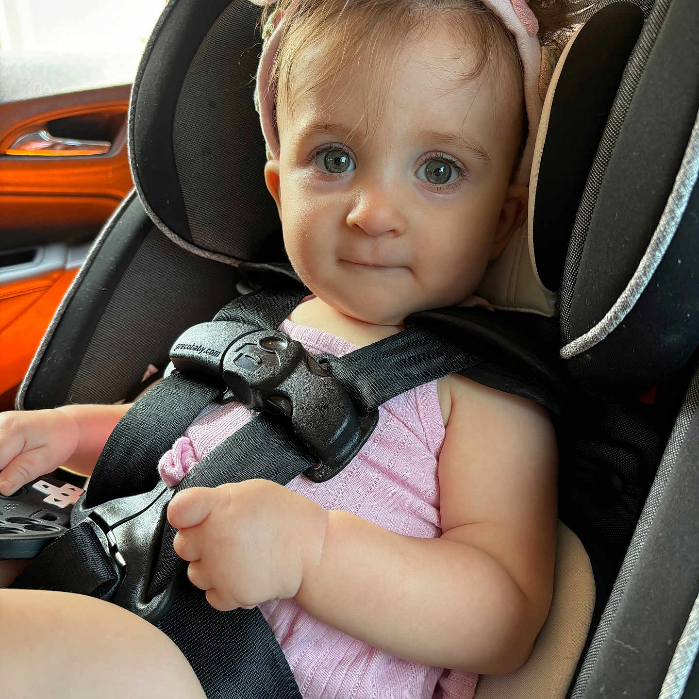 Bexley is registered to the contest to win money with this photo: accessories, baby, belt, bodypart, car, car_interior, carseat, cushion, face, finger, hand, head, headrest, homedecor, person, photography, portrait, seatbelt, transportation, vehicle
