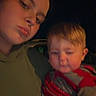 Waylon joined the competition — help win amazing prizes! baby, casual, child, clothing, dark_background, expression, face, holding, indoor, infant, lip_ring, low_light, nose_ring, person, piercing, portrait, selfie, striped_sweater, woman, young_adult