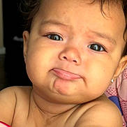 Skylah is registered to the contest to win money with this photo: adorable, baby, cheeks, child, close_up, curly_hair, cute, earring, expression, eyes, face, indoor, infant, person, portrait, pout, shoulders, skin, soft_light, young