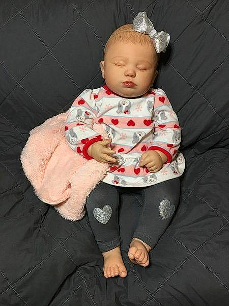 June is registered to the contest to win money with this photo: arm, baby, child, person, sitting, toddler