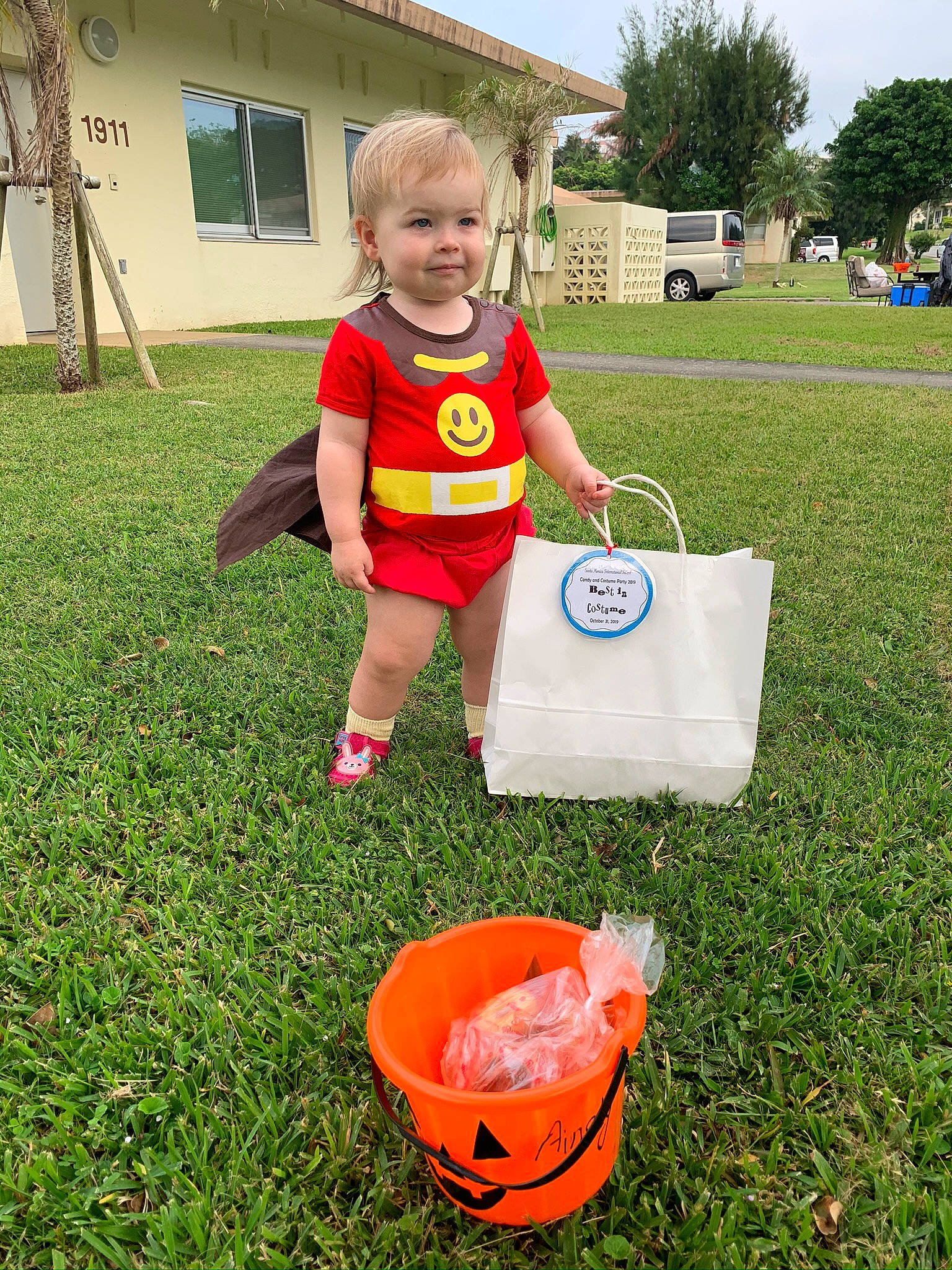 Ainsley joined the competition — help win amazing prizes! bucket, child, competition_event, fun, games, grass, joy, lawn, person, personal_protective_equipment, plant, play, recreation, style, summer, toddler, tree, vacation, yard, yellow