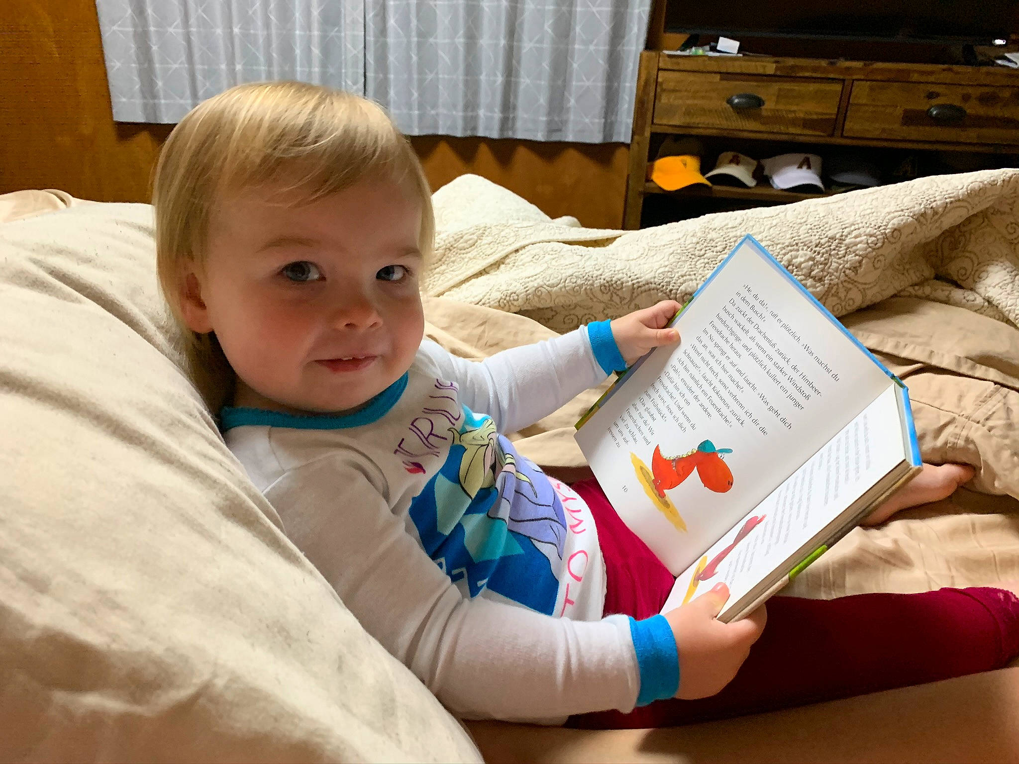 Ainsley is registered to the contest to win money with this photo: baby, child, homework, learning, person, reading, toddler