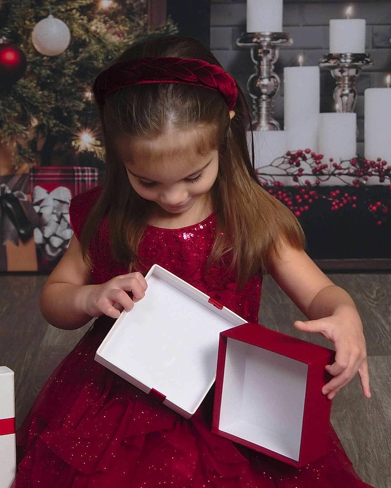 Isabella joined the competition — help win amazing prizes! beauty, carmine, child, christmas_tree, event, facial_expression, fun, happy, holiday, office_supplies, pattern, person, photograph, red, room, sitting, sleeve, snapshot, standing, tablet_computer