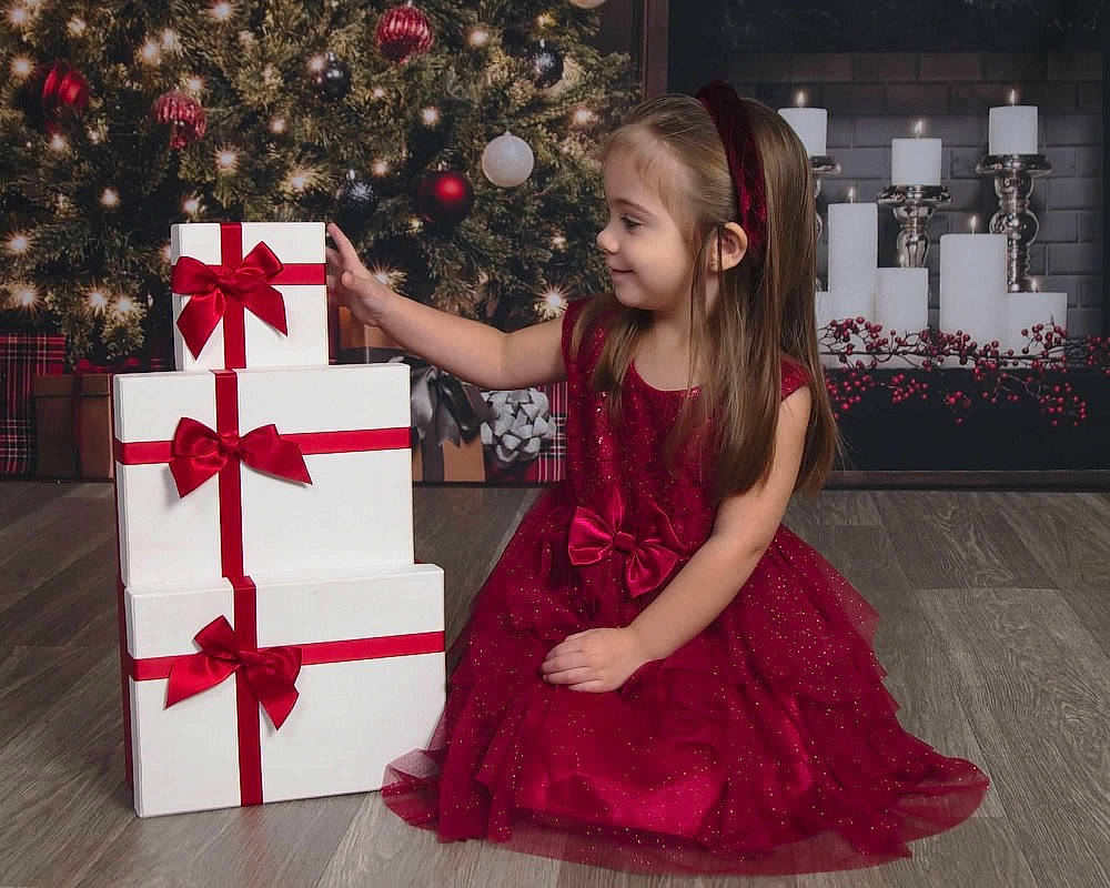 Isabella joined the competition — help win amazing prizes! beauty, christmas, christmas_decoration, christmas_ornament, christmas_tree, dress, event, evergreen, formal_wear, fun, happy, holiday, holiday_ornament, joy, magenta, one_piece_garment, ornament, person, red, toddler