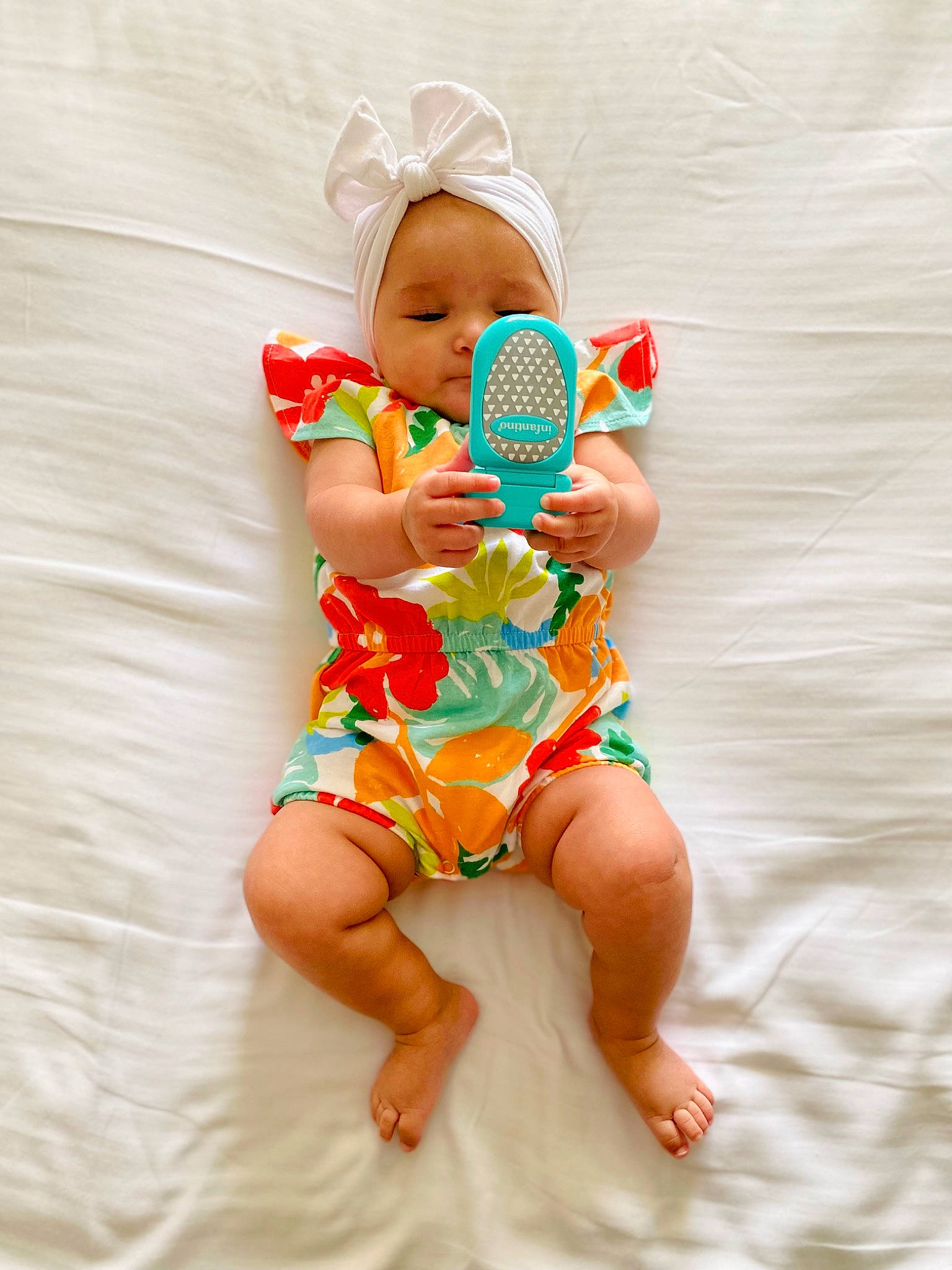 Winter is registered to the contest to win money with this photo: abdomen, baby, baby_toddler_clothing, barefoot, clothing, comfort, diaper, eye, finger, foot, happy, head, human_body, infant_bodysuit, leg, person, stomach, textile, thigh, toddler