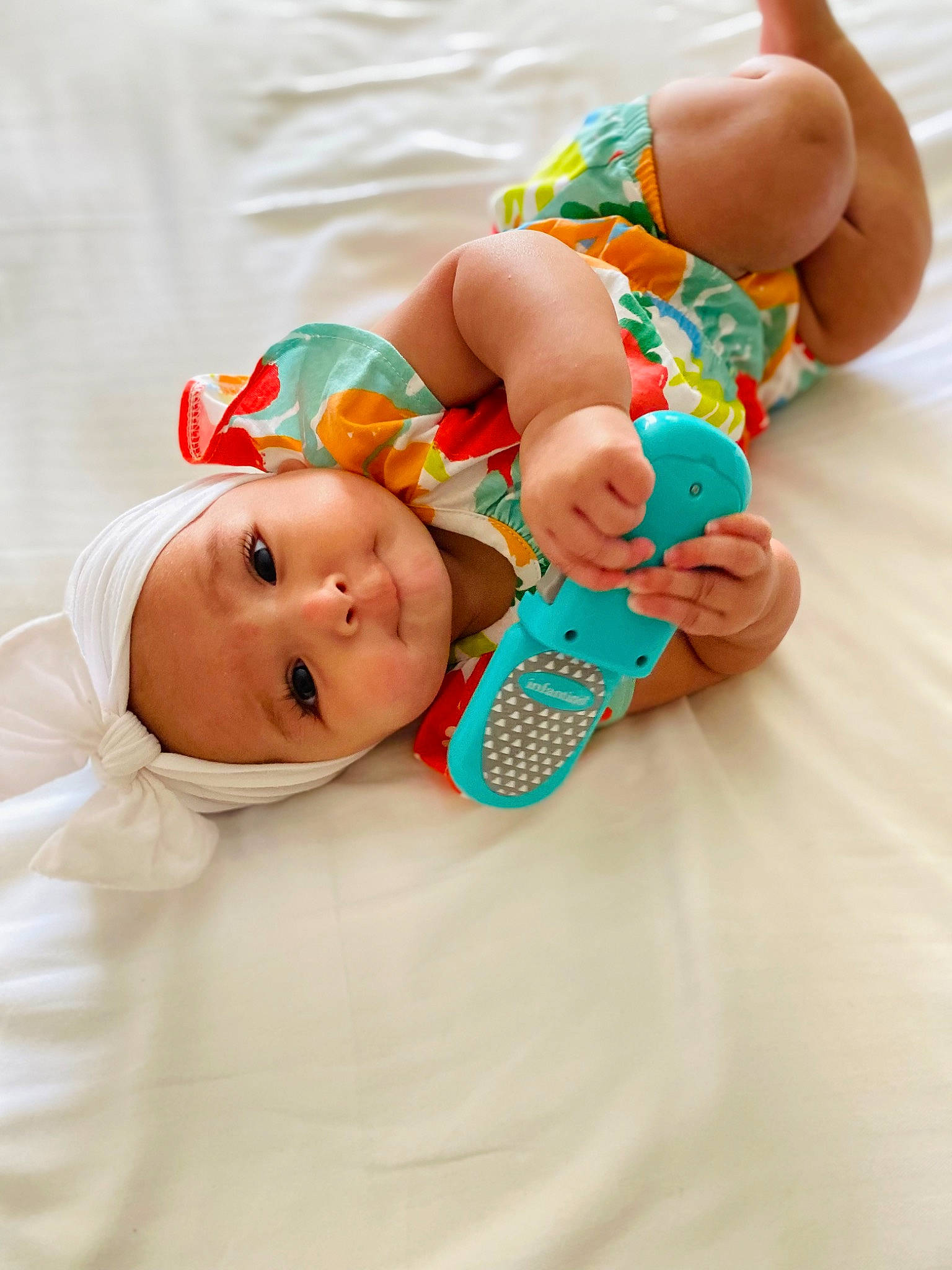 Winter is registered to the contest to win money with this photo: baby, baby_products, baby_safety, baby_toddler_clothing, cheek, child, comfort, dress, face, finger, foot, hand, happy, hat, headwear, human_body, linens, orange, person, skin