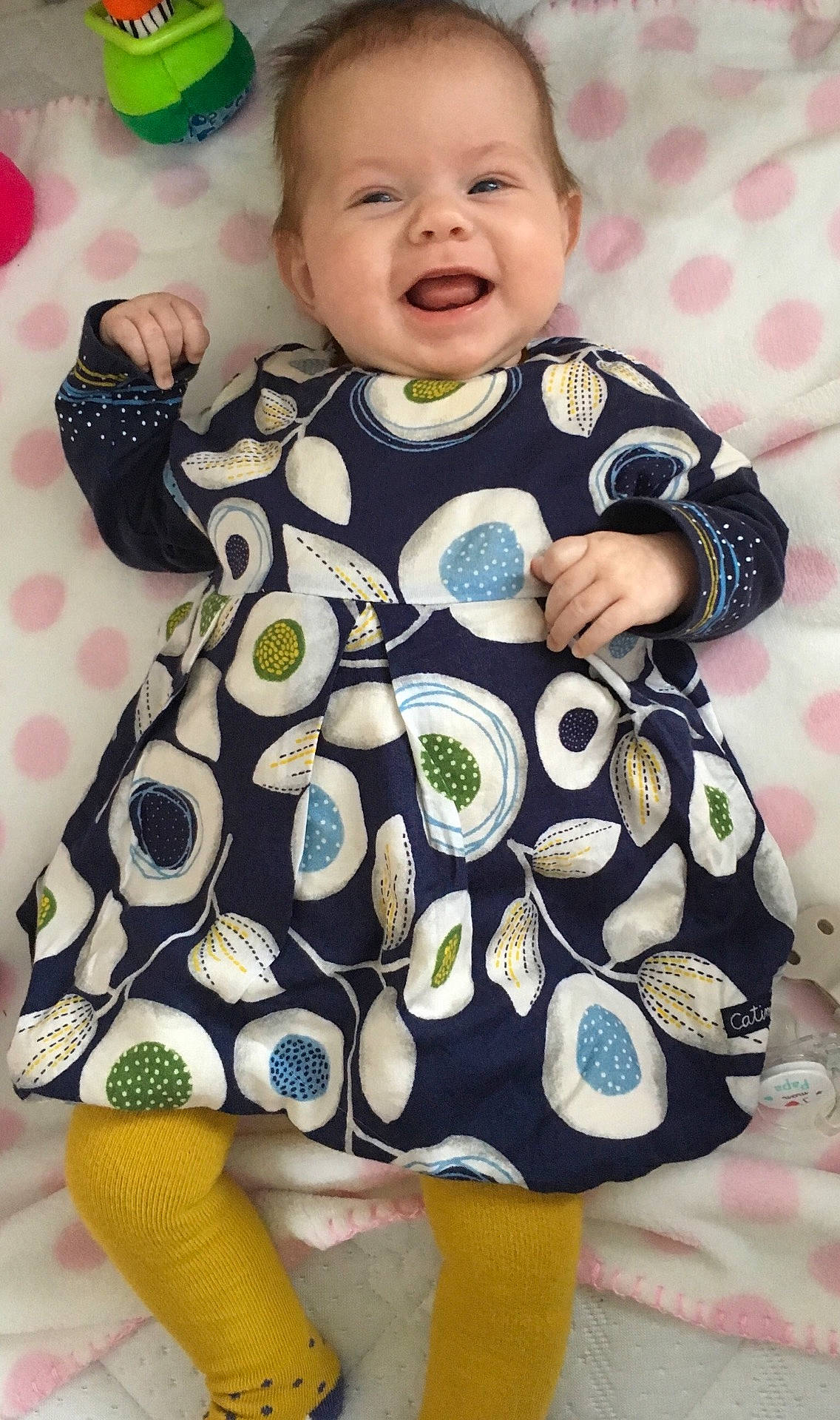 Cassandre a rejoint le concours — aidez-le/la à gagner de superbes lots ! baby_products, child, clothing, design, dress, girl, infant, material, outerwear, pattern, person, play, product, skin, sleeve, smile, textile, toddler, toy