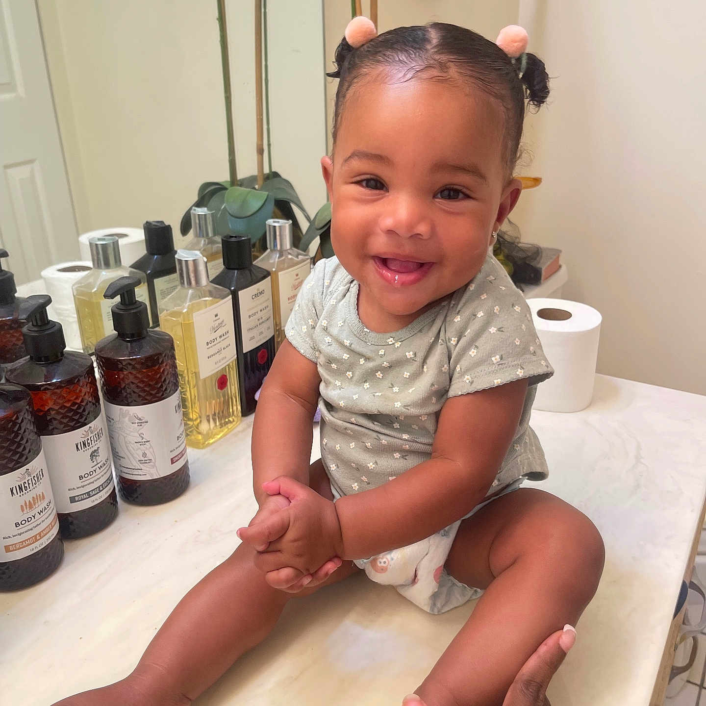 Cali is registered to the contest to win money with this photo: baby, bodypart, bottle, child, cosmetics, face, female, finger, girl, hand, happy, head, herbal, herbs, perfume, person, photography, plant, portrait, sitting