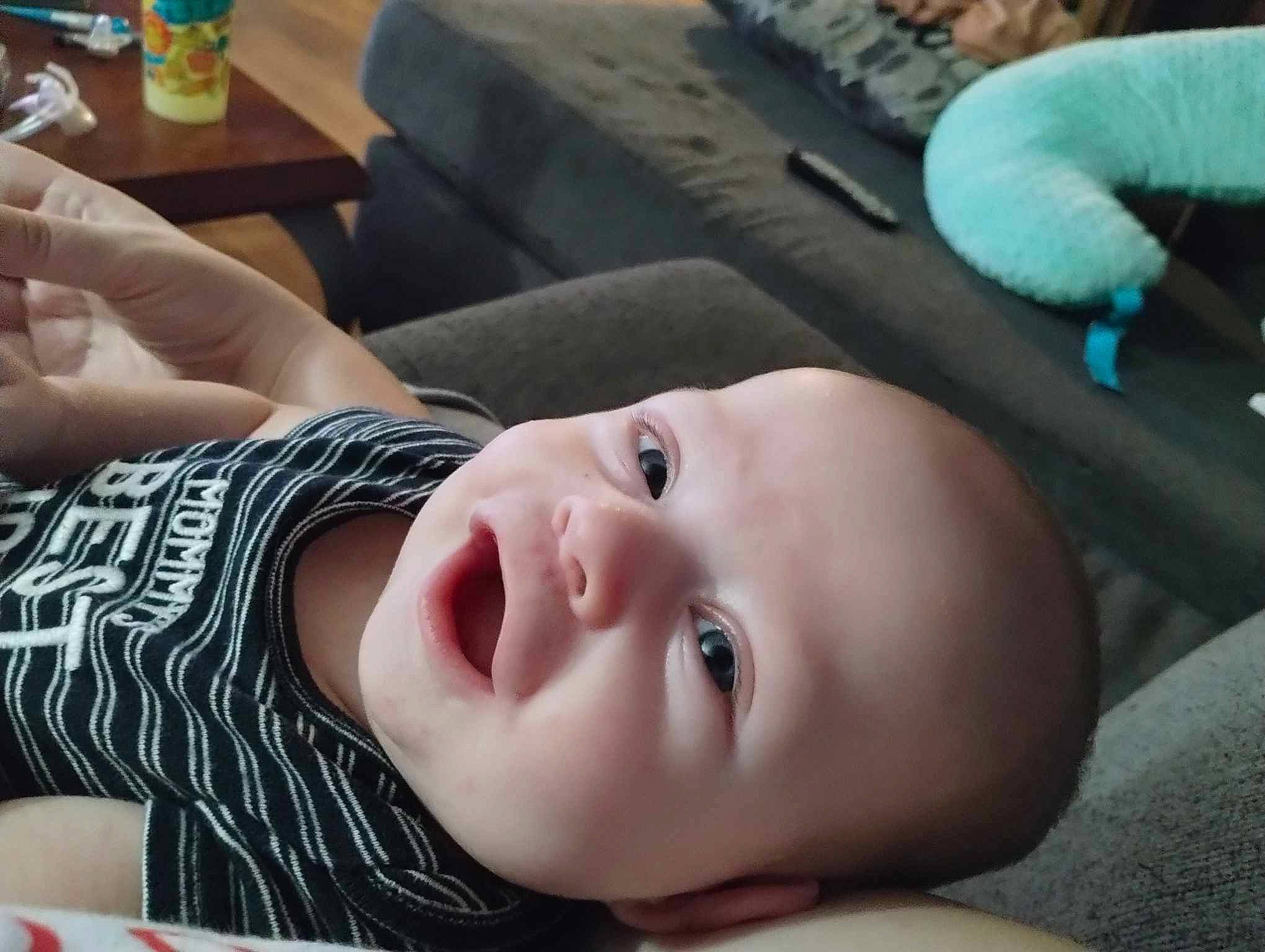 Noah joined the competition — help win amazing prizes! baby, baby_toddler_clothing, black, cheek, child, eyelash, facial_expression, fun, grass, green, happy, lip, mouth, nose, person, room, sitting, skin, smile, toddler