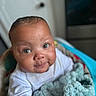 Jeremiah is registered to the contest to win money with this photo: baby, infant, child, blanket, soft_texture, white_clothing, portrait, cute, smiling, indoor, closeup, face, chubby_cheeks, curious_eyes, candid, cozy, warm, happy, baby_boy, toddler