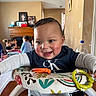 Jeremiah is registered to the contest to win money with this photo: baby, child, smiling, indoor, walker, toy, group, children, happy, family, play, furniture, table, person, room, casual, clothing, head, face, joy