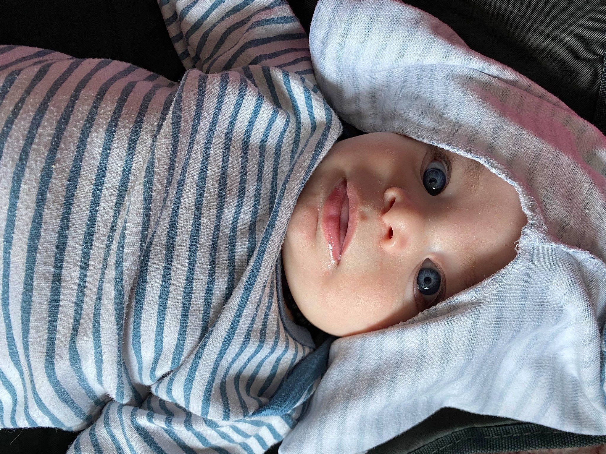 Axl is registered to the contest to win money with this photo: baby, baby_toddler_clothing, cheek, child, chin, comfort, eyebrow, eyelash, fur, head, headwear, linens, lip, mouth, nose, pattern, person, portrait_photography, skin, sleeve