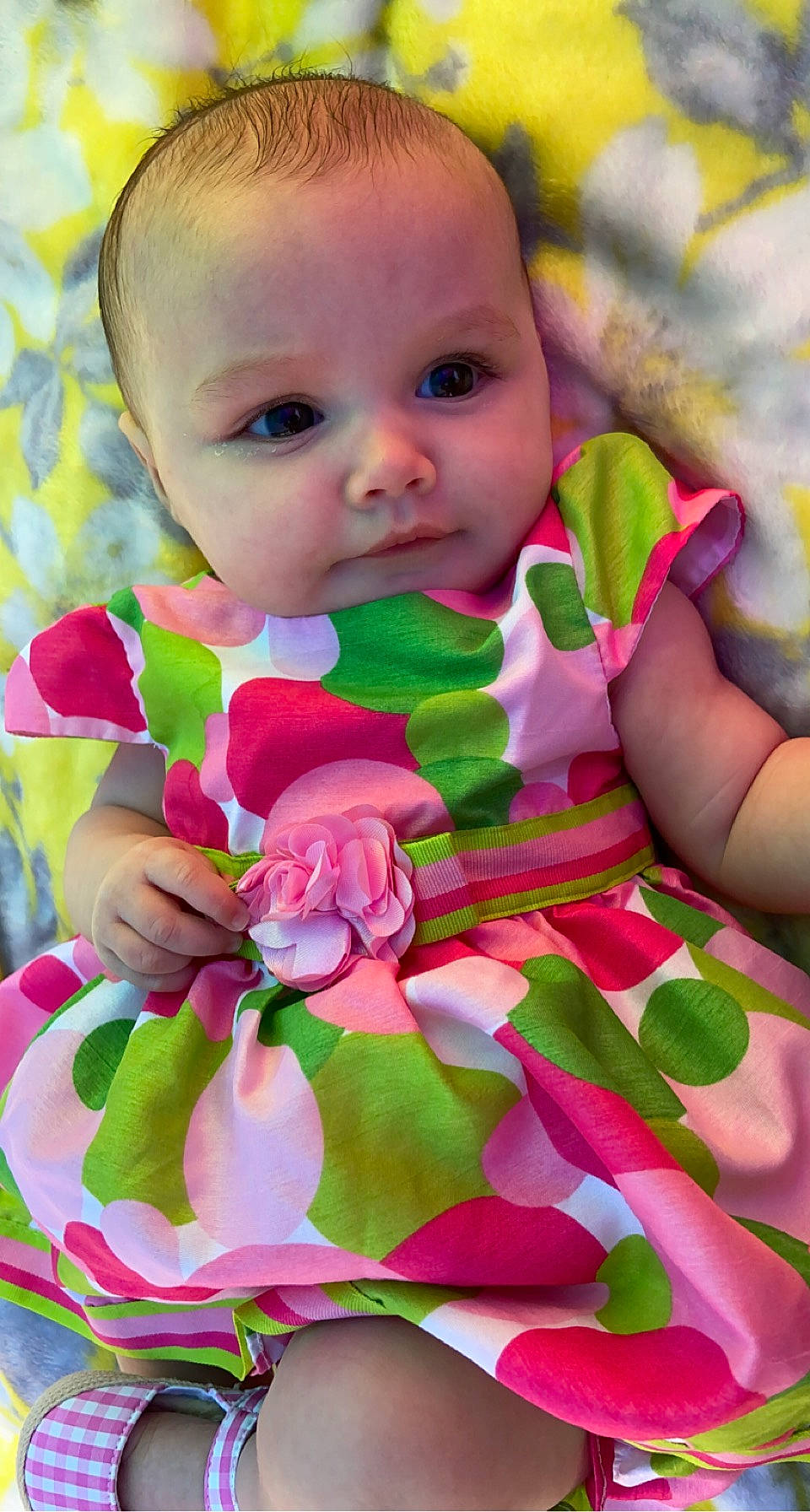 Mckayla joined the competition — help win amazing prizes! baby, baby_products, baby_toddler_clothing, cheek, child, dress, grass, happy, iris, linens, magenta, pattern, people_in_nature, person, petal, pink, plant, skin, sleeve, textile