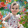 toddler, child, girl, blue_eyes, pink_bow, floral_dress, smile, portrait, outdoor, garden, flowers, colorful, nature, summer, cute, happy, innocent, soft_focus, greenery, baby