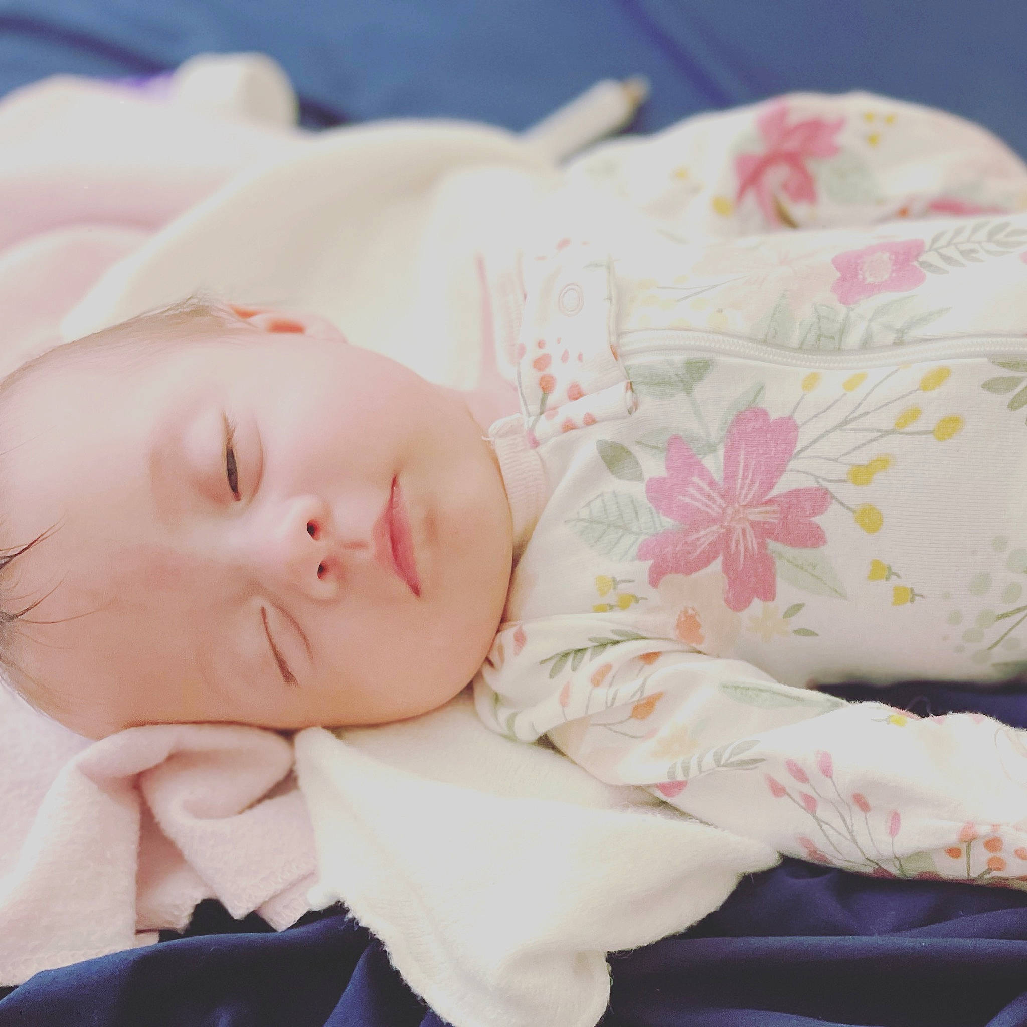 Kinley joined the competition — help win amazing prizes! baby, baby_sleeping, baby_toddler_clothing, bedding, bedtime, child, comfort, eyelash, fashion_accessory, flower, hand, happy, hat, linens, lip, pattern, person, pink, skin, sleeve