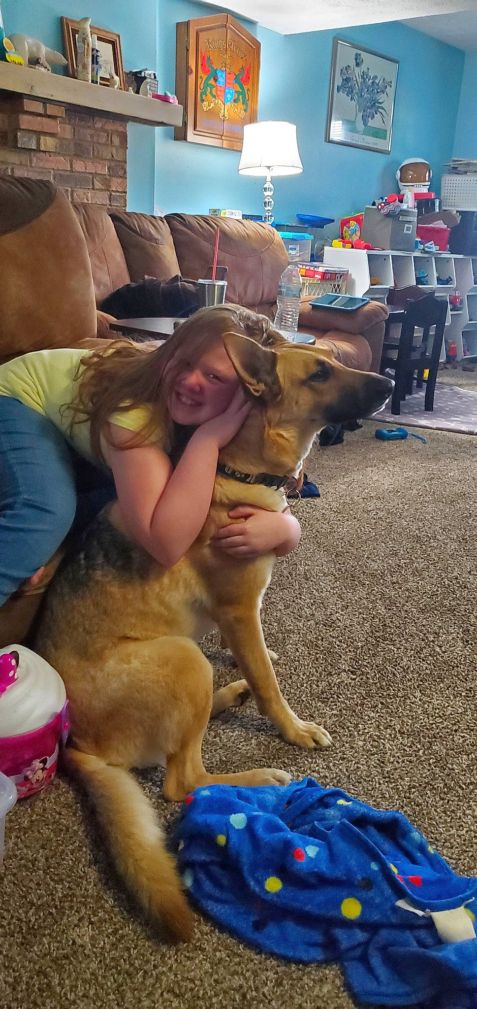 Elizabeth is registered to the contest to win money with this photo: blue, carnivore, comfort, companion_dog, couch, dog, dog_breed, fawn, flooring, fun, hat, human_leg, leisure, mammal, photograph, snapshot, thigh, vacation, vertebrate, working_animal