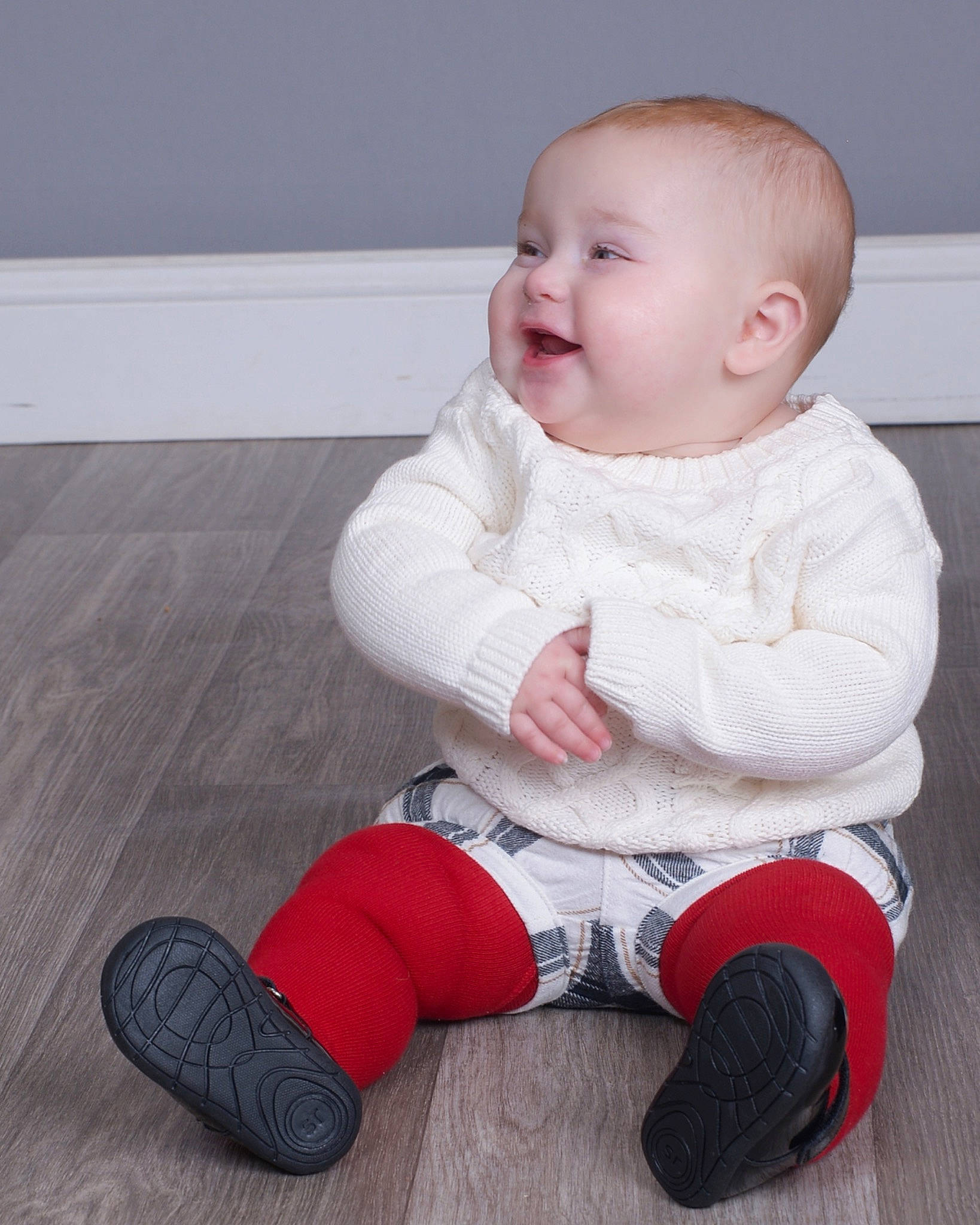 Madisyn is registered to the contest to win money with this photo: baby, baby_toddler_clothing, cheek, floor, flooring, happy, human_leg, joint, knee, pattern, person, shoe, sitting, skin, sleeve, smile, sneakers, sock, thigh, toddler