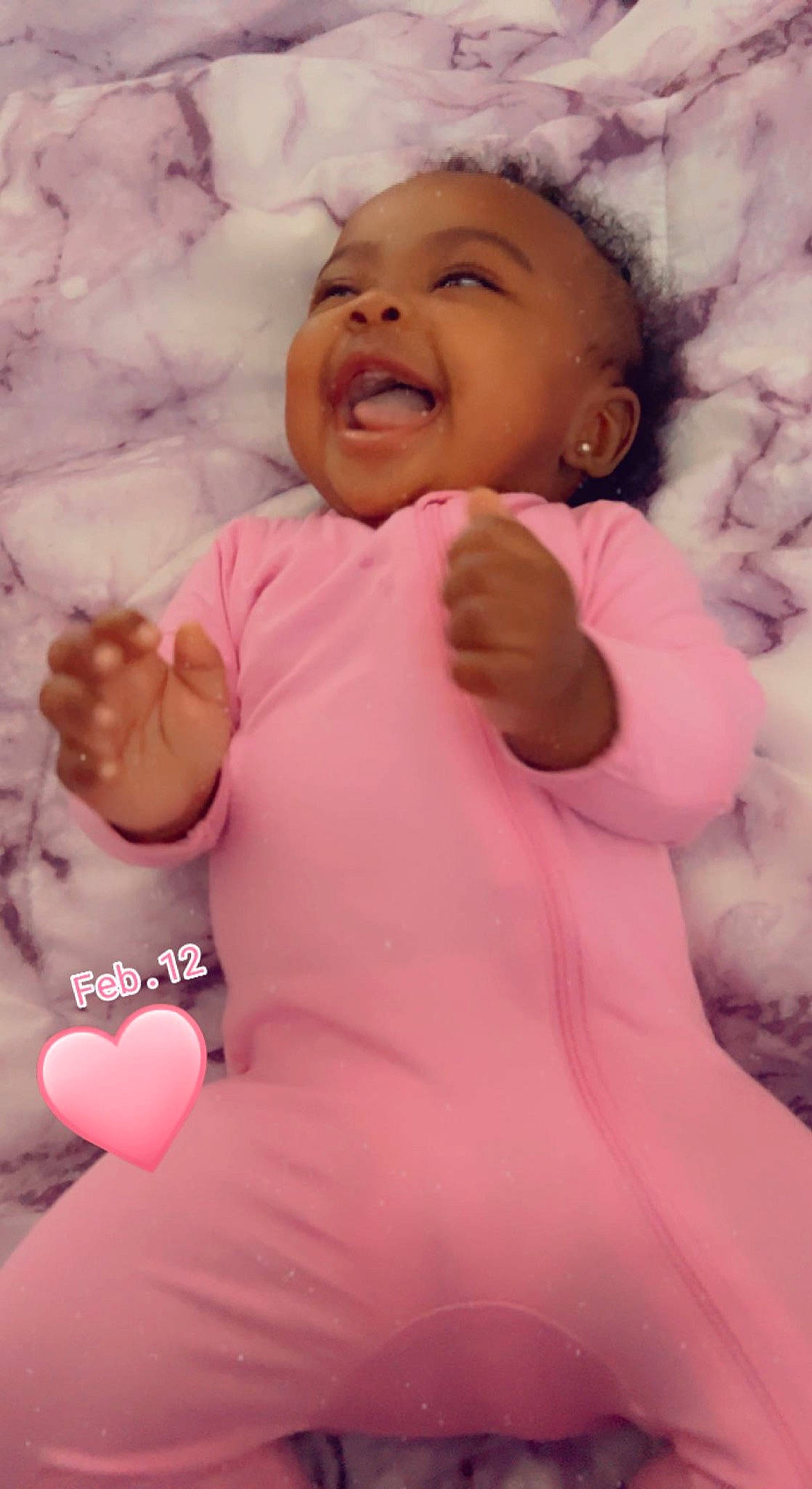 Skylar joined the competition — help win amazing prizes! baby, baby_sleeping, baby_toddler_clothing, cheek, chin, comfort, face, finger, gesture, happy, head, headwear, lip, mouth, nose, person, pink, skin, sleeve, smile