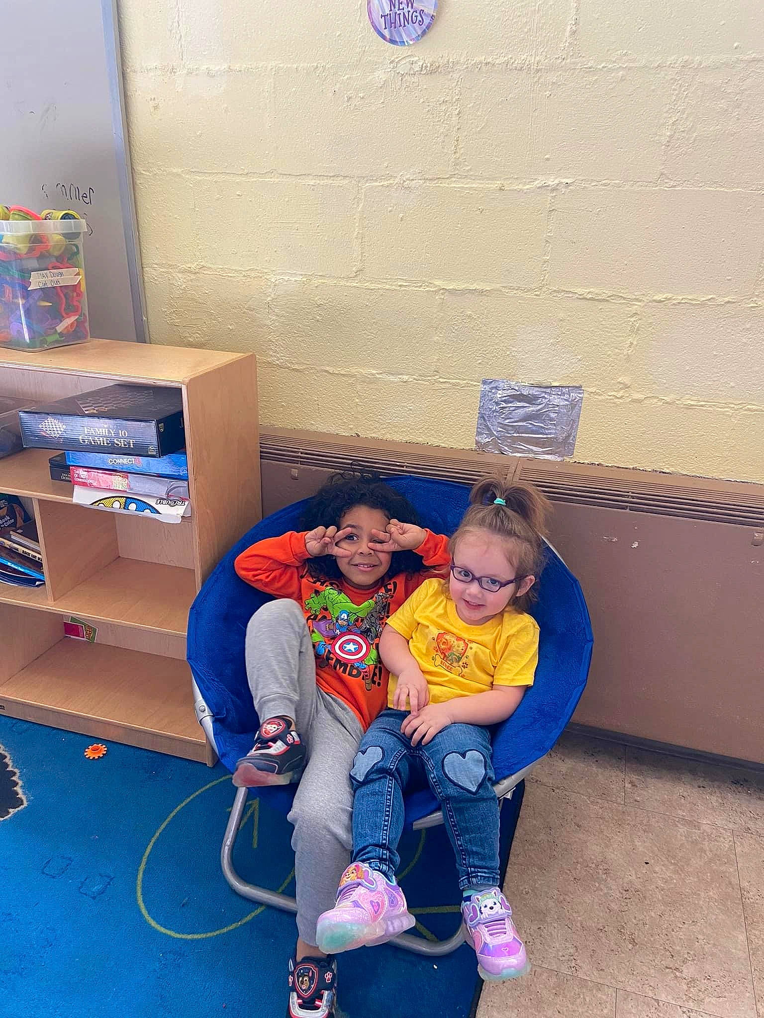 Renee joined the competition — help win amazing prizes! box, cardboard, child, comfort, couch, electric_blue, floor, flooring, fun, joy, leisure, machine, person, play, purple, room, shipping_box, shoe, sitting, sneakers