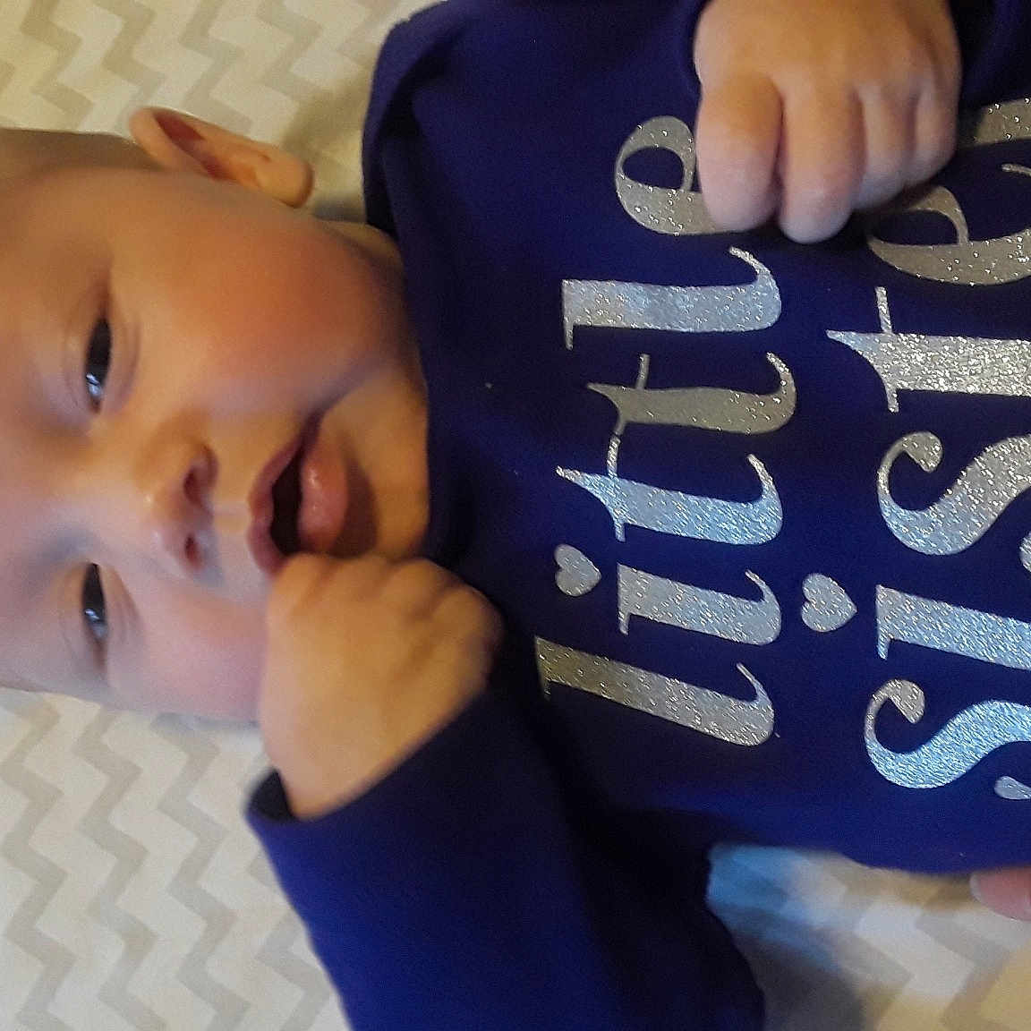 Kiley is registered to the contest to win money with this photo: arm, baby, baby_toddler_clothing, blue, cheek, child, ear, eye, face, finger, forehead, hand, head, mouth, nose, product, skin, smile, thumb, toddler