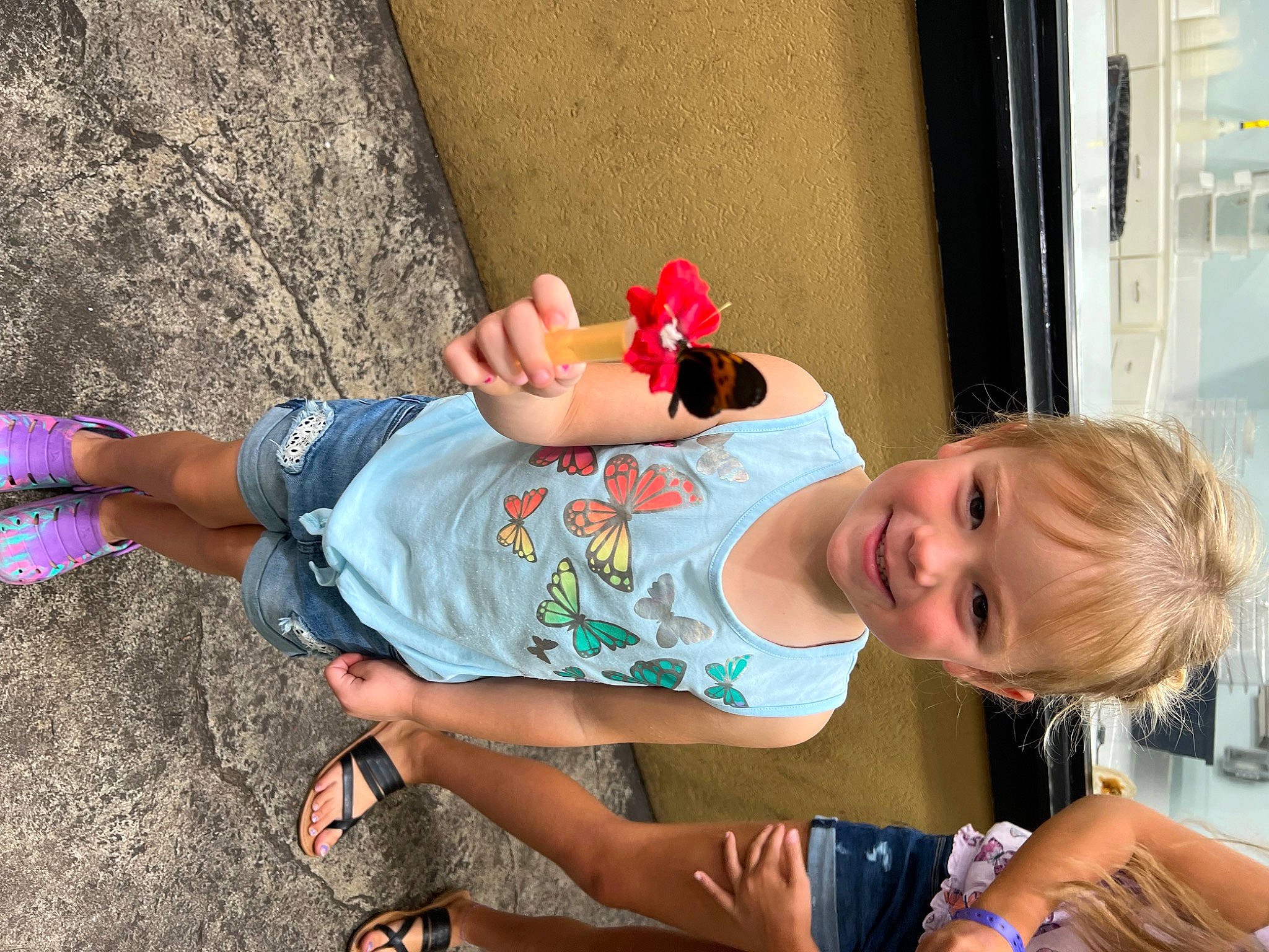 Karissa joined the competition — help win amazing prizes! baby, baby_toddler_clothing, child, clothing, eyewear, fun, happy, hat, human_leg, joy, leisure, person, pink, play, recreation, sandal, sitting, t_shirt, thigh, toddler