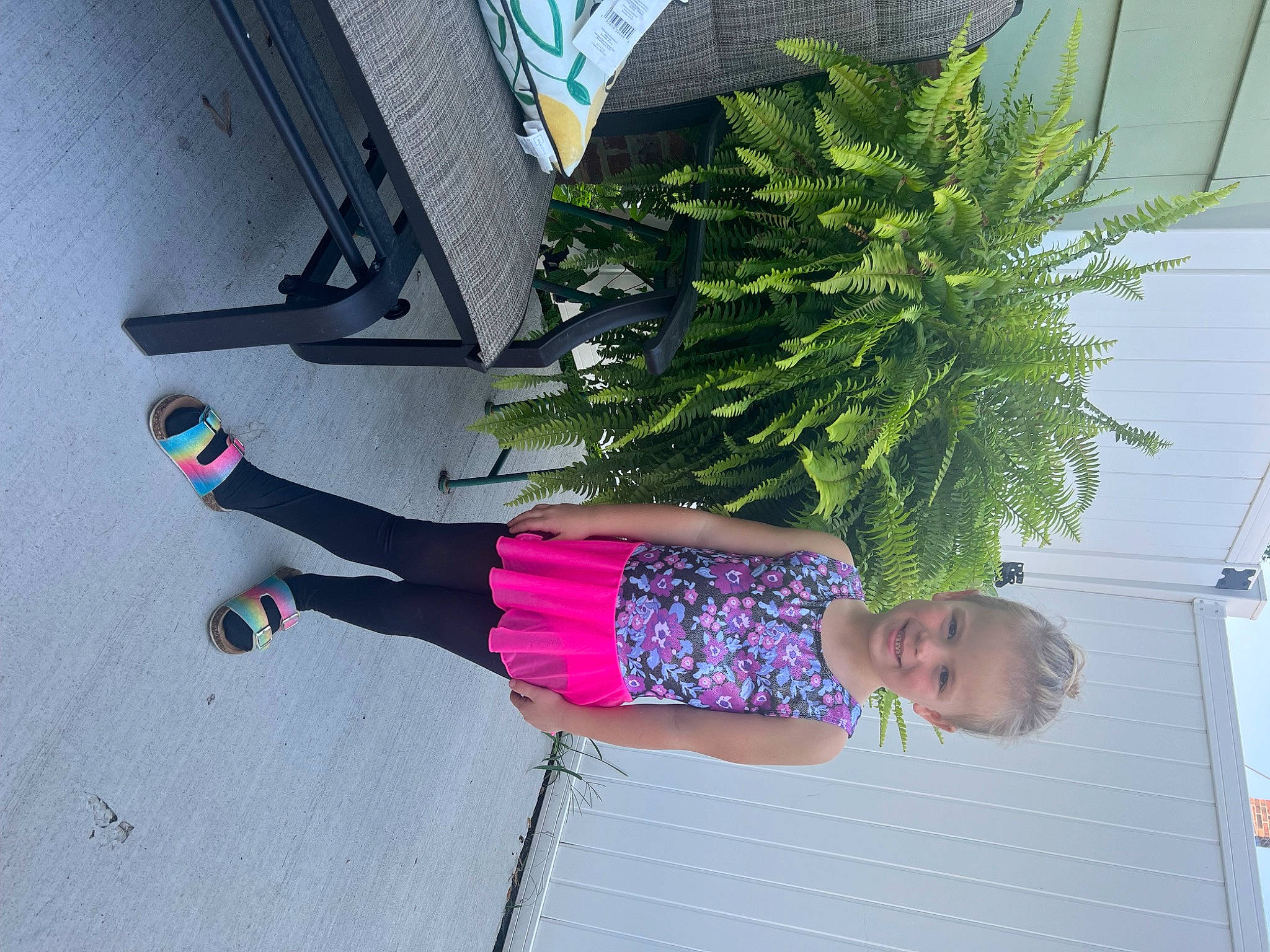 Karissa is registered to the contest to win money with this photo: arecales, electric_blue, floral_design, flowerpot, houseplant, human_leg, joy, magenta, pattern, person, plant, road_surface, shadow, sidewalk, thigh, tree, waist