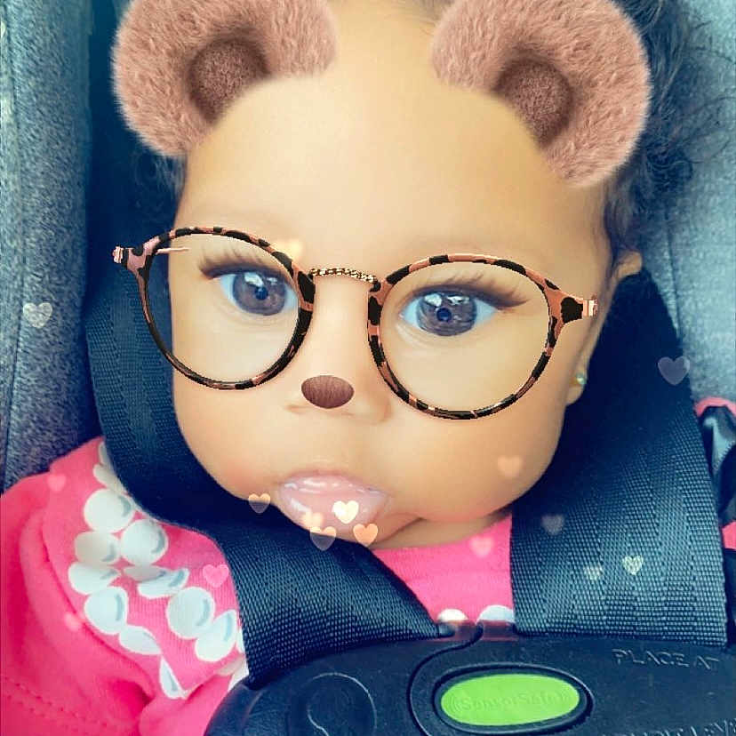 Raina is registered to the contest to win money with this photo: cap, cartoon, cheek, cool, doll, eyelash, eyewear, glasses, head, knit_cap, lip, magenta, nose, organ, pink, skin, stuffed_toy, textile, toy, vision_care