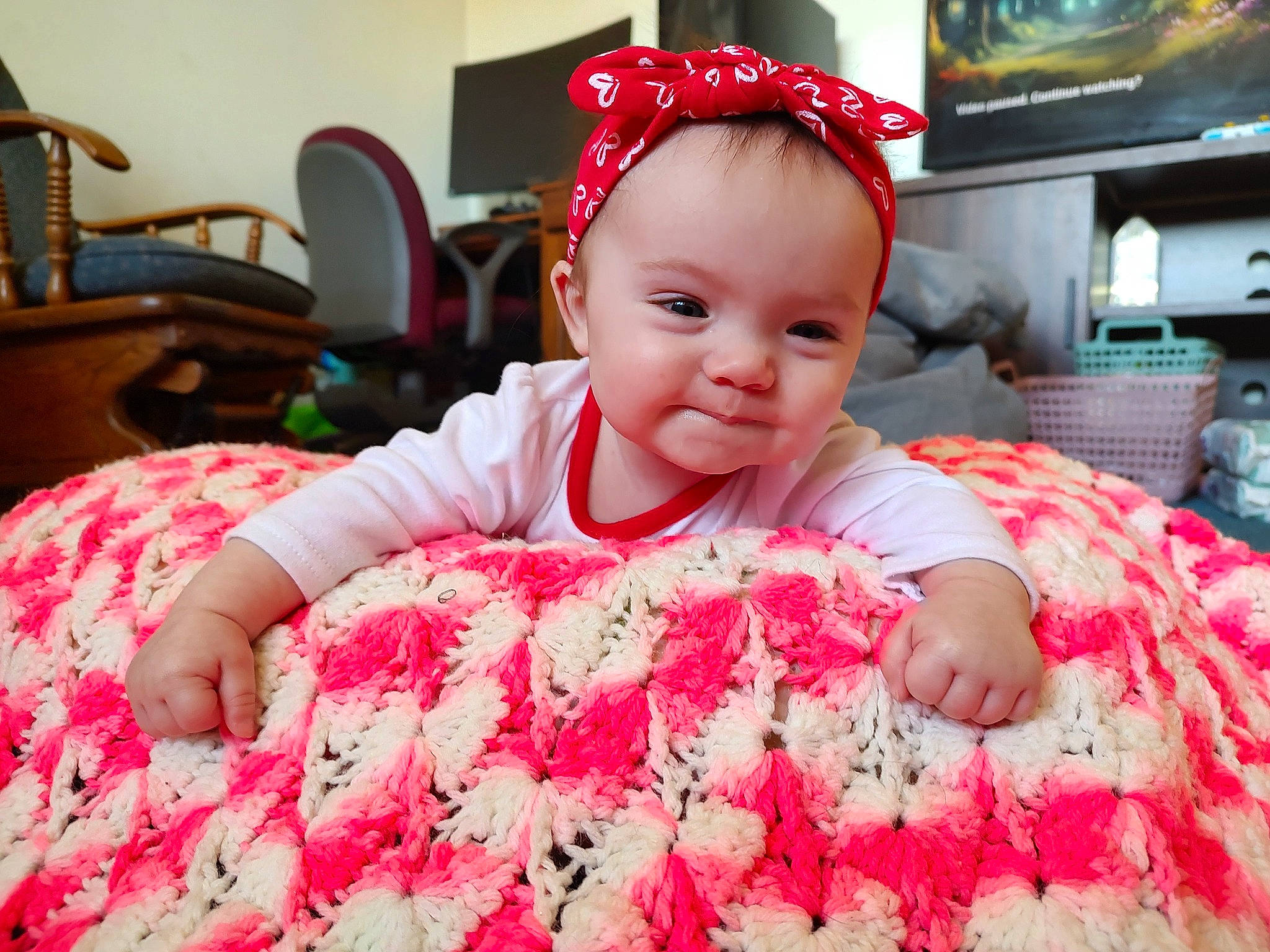 Allyson joined the competition — help win amazing prizes! baby, baby_toddler_clothing, child, comfort, event, facial_expression, fun, happy, holiday, linens, magenta, pattern, person, pink, red, skin, sleeve, t_shirt, television, textile