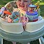 baby, blue_eyes, child, cute, daytime, fence, foot, garden, grass, happy, infant, outdoor, plastic_toy, playful, portrait, seat, smiling, sunlight, toy, walker