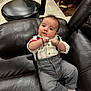 Zackary joined the competition — help win amazing prizes! baby, infant, child, couch, leather, shirt, pants, socks, bracelet, suspenders, indoor, furniture, floor, tile, chair, wood, portrait, cute, smiling, relaxed