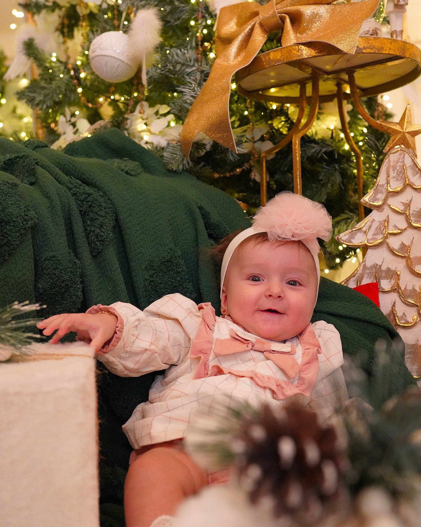 Evelyn joined the competition — help win amazing prizes! baby, baby_toddler_clothing, christmas, christmas_decoration, christmas_eve, christmas_ornament, christmas_tree, event, fun, happy, hat, holiday, holiday_ornament, human_body, ornament, person, plant, toddler, tradition, tree