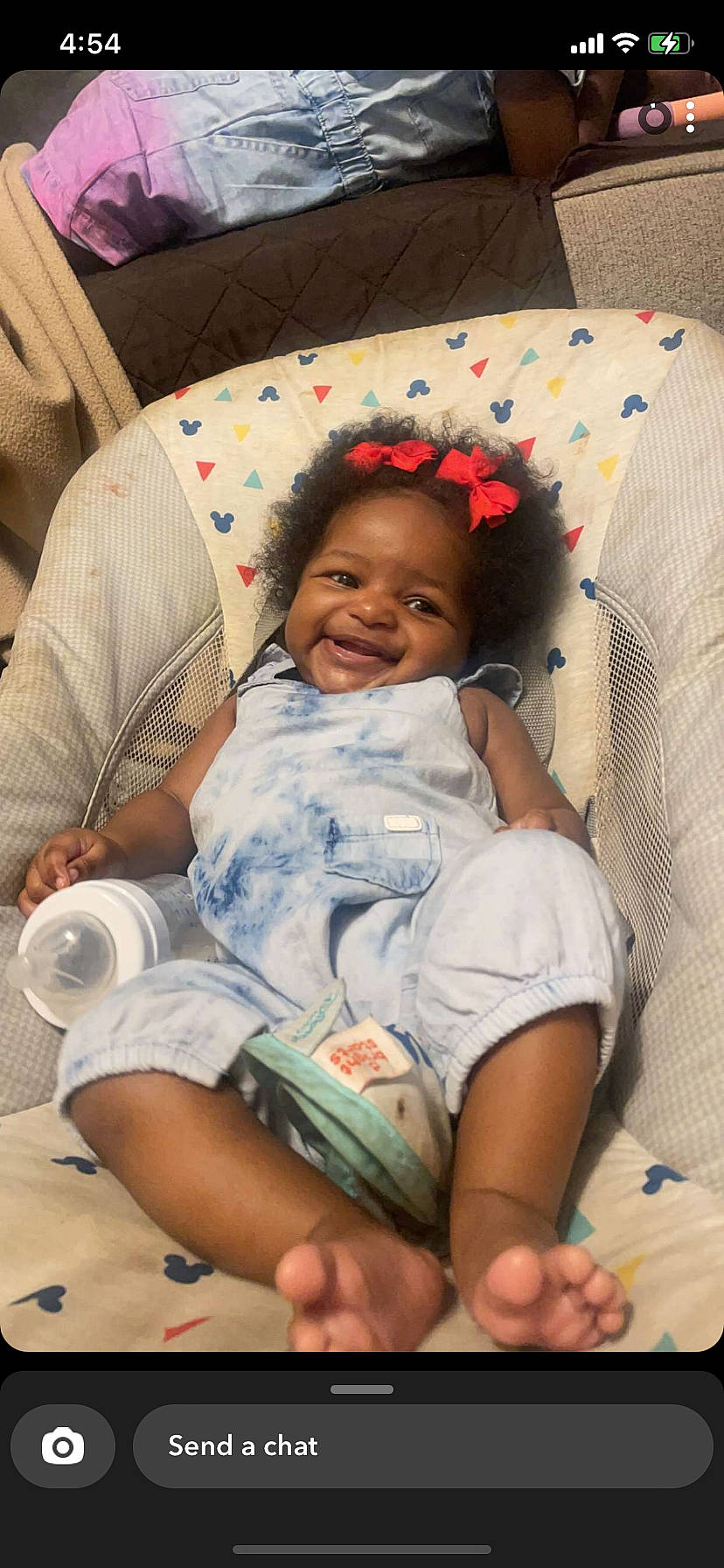 Devyn is registered to the contest to win money with this photo: abdomen, baby, baby_products, baby_toddler_clothing, cheek, child, comfort, couch, elbow, happy, human_leg, joy, knee, lap, linens, person, pillow, sitting, skin, smile