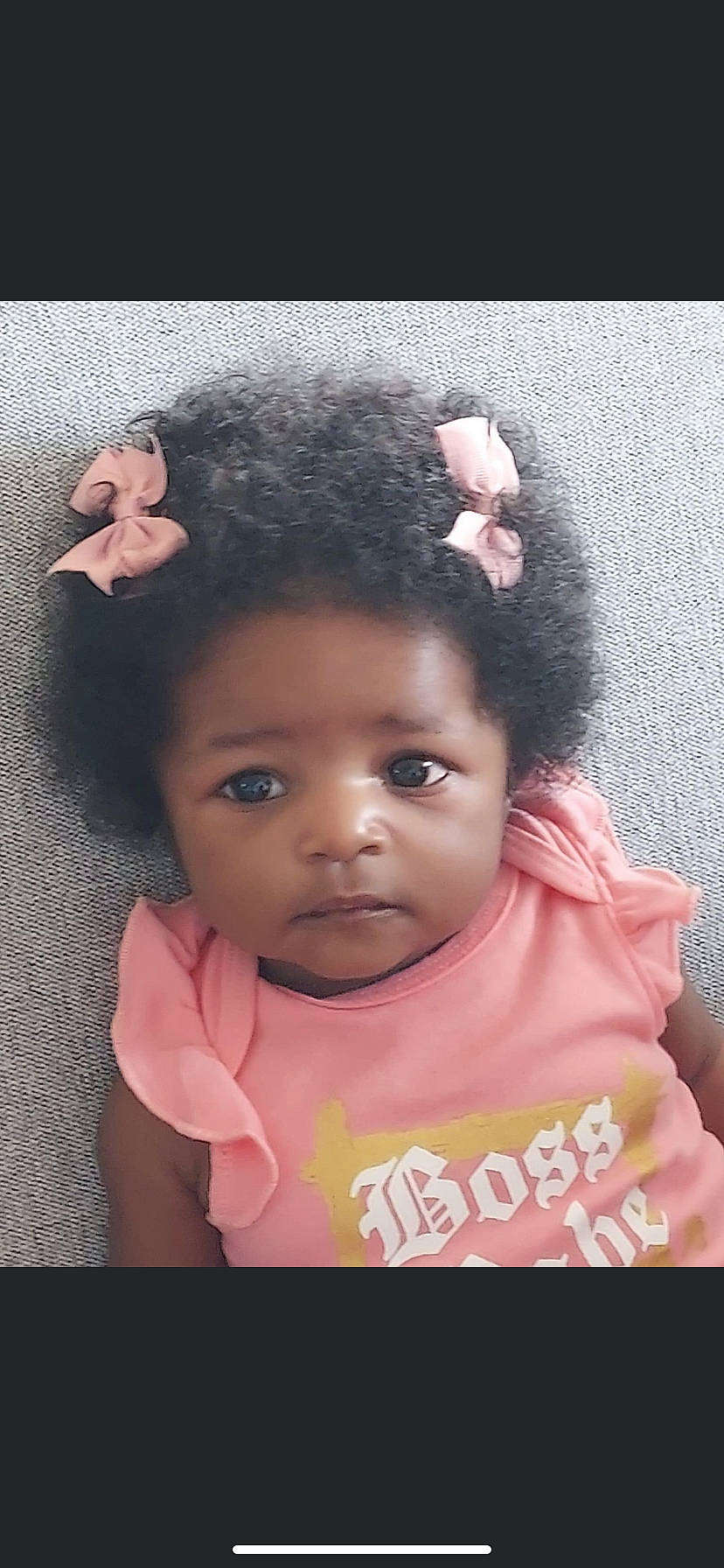 Devyn is registered to the contest to win money with this photo: baby, baby_toddler_clothing, black_hair, cheek, dress, ear, eyebrow, eyelash, flash_photography, forehead, gesture, happy, iris, lip, magenta, nose, person, pink, skin, sleeve