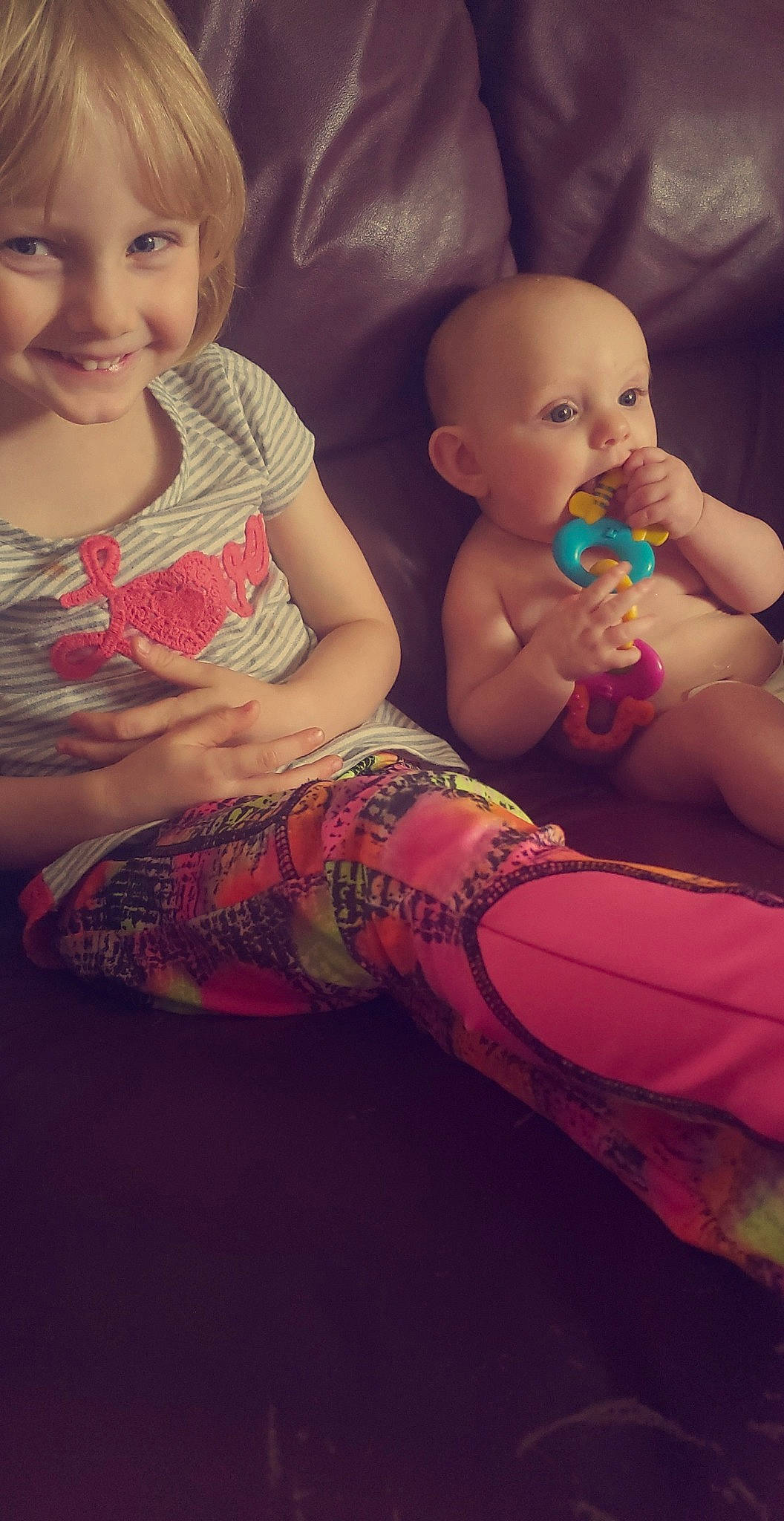 Luna is registered to the contest to win money with this photo: abdomen, arm, baby, cheek, child, eye, face, finger, fun, hand, head, iris, joy, leg, lip, mouth, person, pink, sitting, skin